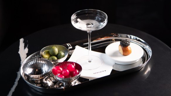 The signature Caviar Martini comes with osetra caviar perched on a pretzel (right).