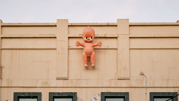 The kewpie doll retains its position on the Bimbo facade.