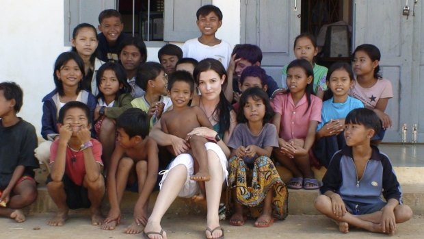 Tara Winkler (seen here with Cambodian children in 2007) set up her own orphanage in  Battambang, in the west of the country, before turning away from centre-based care for children, which she now calls a "trap".