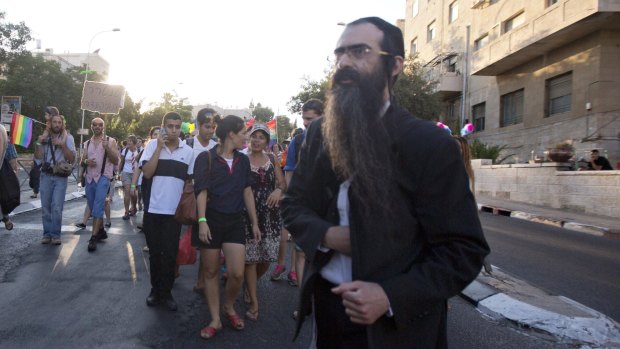 Yishai Schlissel joins the Gay Pride parade moments before his stabbing attack on July 30. Police had been warned of his release and told to bar him from approaching the gay pride march.