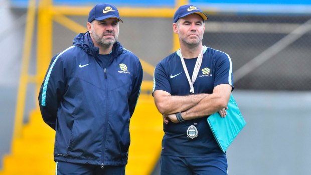 Ange Postecoglou (left) and his assistant Ante Milicic watch the Australian players train.