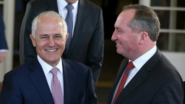 Prime Minister Malcolm Turnbull and Deputy Prime Minister Barnaby Joyce pose for photos after the swearing-in ceremony at Government House on Thursday.