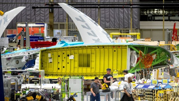 A view of the new Boeing 777X wing from the interface with the fuselage in the foreground and the folded wingtip at the far end. The first 777X will fly in 2019. (Mike Siegel/The Seattle Times/TNS) Boeing 777X under construction in Everett near Seattle.
