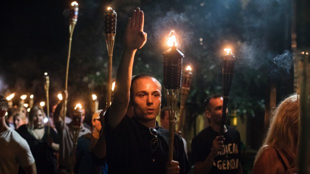 A white supremacist gives a Nazi salute in Charlottesville.