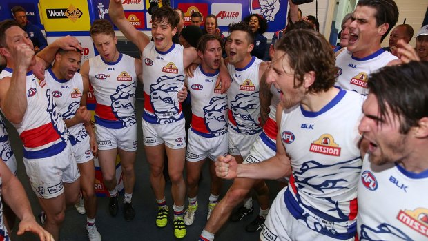 The Bulldogs sing the song on Thursday night.
