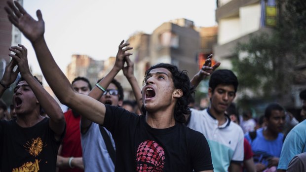 Supporters of the Muslim Brotherhood chant slogans against the Egyptian court ruling of the death sentence for Mohammed Morsi.