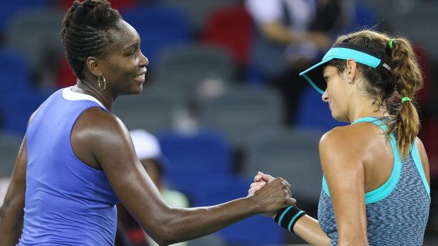 Williams shakes hands with Julia Goerges of Germany, after defeating the German in straight sets.