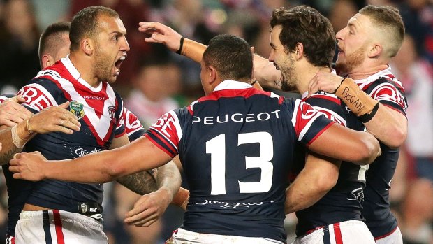 Minor miracles: The Roosters celebrate a try to Blake Ferguson.