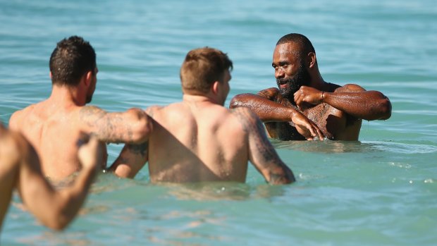 In the swim: Semi Radradra in the water with the Australia Kangaroos Test team at Coogee Beach on Monday.