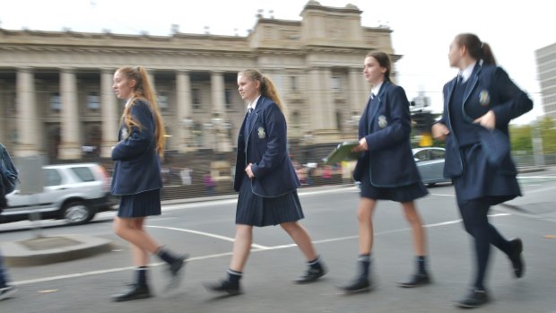 Freedom: year 9 students from the  Academy of Mary Immaculate use the city as their classroom, regularly visiting landmarks for different subjects. Kit Scarff, left, Phoebe Anderton, Kiera McCormack and Georgie Woodall head along Spring Street on a treasure hunt. 
