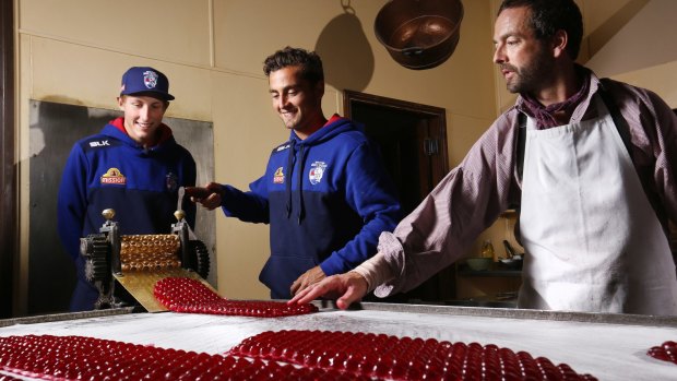 Bailey Dale, Dahlhaus and confectioner Ben Bignell make raspberry drops.