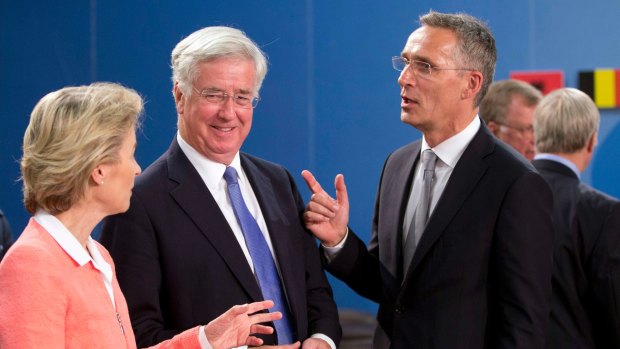 British Defence Secretary Sir Michael Fallon, centre,  with his German counterpart Ursula von der Leyen, left, and NATO Secretary-General Jens Stoltenberg  in Brussels last month.