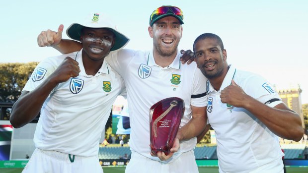 Lost the battle, won the war: Kagiso Rabada, Kyle Abbott and Vernon Philander celebrate with the trophy after the series win.