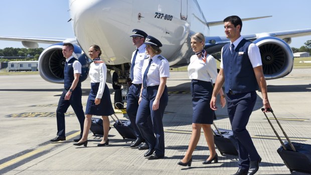Rex crew at the unveiling of the airline's new uniforms at Sydney Airport on Friday.