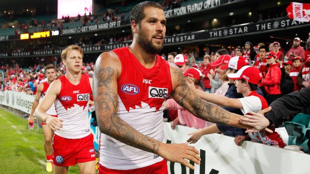 Strong start: Lance Franklin celebrates with fans after kicking six goals in the big win over Essendon.