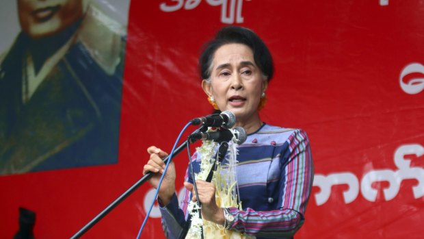Myanmar Opposition Leader Aung San Suu Kyi speaks during her 'Election Awareness Tour' in Ho-Pong township, Myanmar on Sunday.