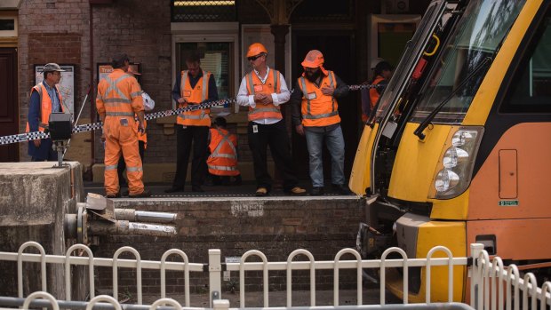 Inspectors at the scene of the train crash on Monday.