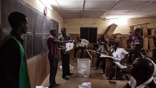 Election officials start counting ballots in Ouagadougou on Sunday.