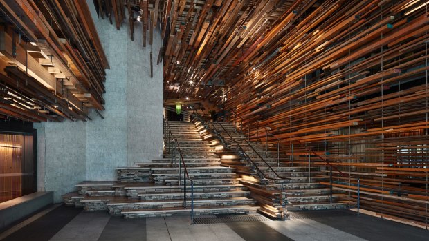 The grand staircase, composed of a frenzy of horizontal strips of recycled, rough-hewn timber.