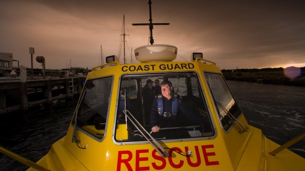 Ian Graham from the Geelong crew rides along with the Queenscliffe volunteer coast guard.