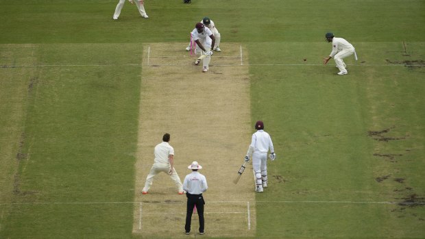 Gone: Jason Holder is caught by Joe Burns on the opening day.
