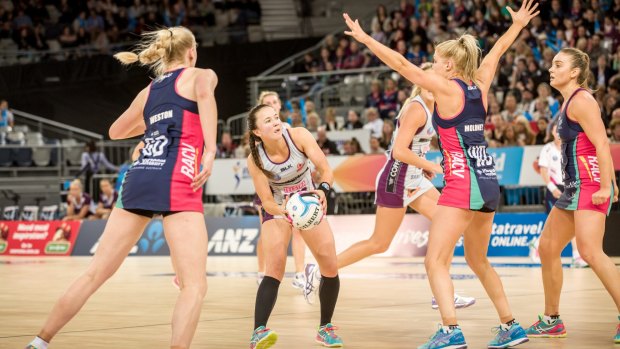 In control: Caitlyn Nevins of the Queensland Firebirds goes on the attack against the Melbourne Vixens.