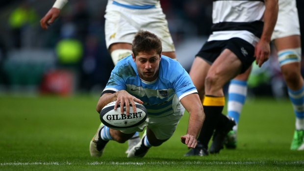 Five points right there: Santiago Cordero evades the Barbarians to go over and score a try during the match between the Barbarians and Argentina at Twickenham.