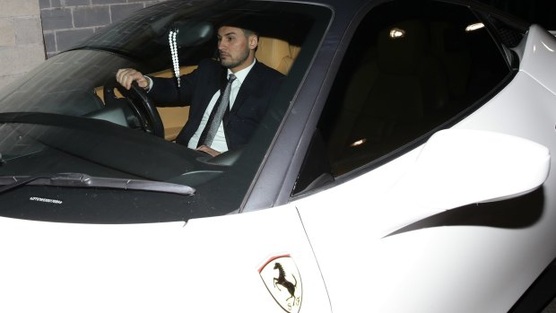 Auburn deputy mayor Salim Mehajer leaves an Auburn council meeting in his white Ferrari. 