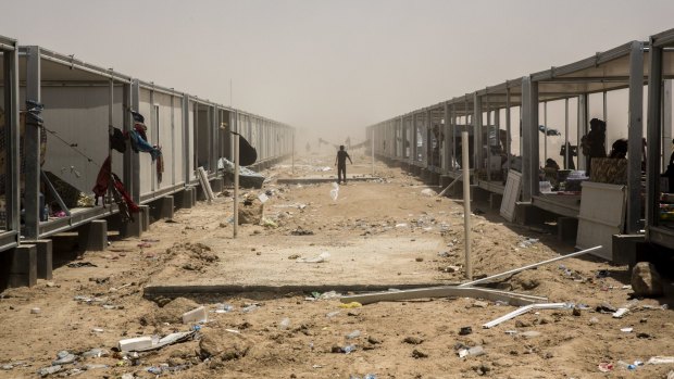 Families displaced by fighting in the Anbar Province occupy half-built structures at a camp in Amiriyat Fallujah.