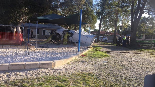 The ute entangled in the school's playground. 