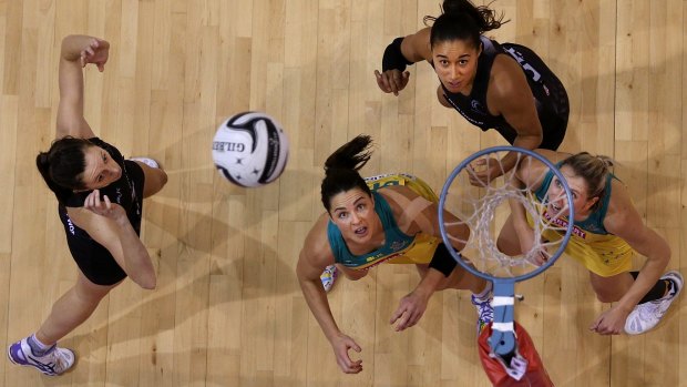 Net loss: New Zealand's Bailey Mes takes a shot at goal as Sharni Layton and Clare McMeniman of Australia hunt for a rebound.
