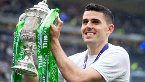 Hero: Tom Rogic lifts the Scottish Cup after scoring the injury-time winner for Celtic against Aberdeen.