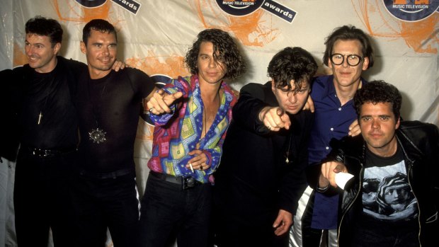 Superstars: Garry Beers and INXS during their heyday in the early 1990s.