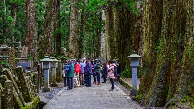 People visit the Okunoin Cemetery on Mount Koya (Koyasan) in Wakayama, Japan.