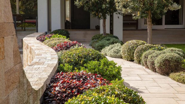 You don’t need to use it everywhere; a simple retaining wall and pathway can be enough. 