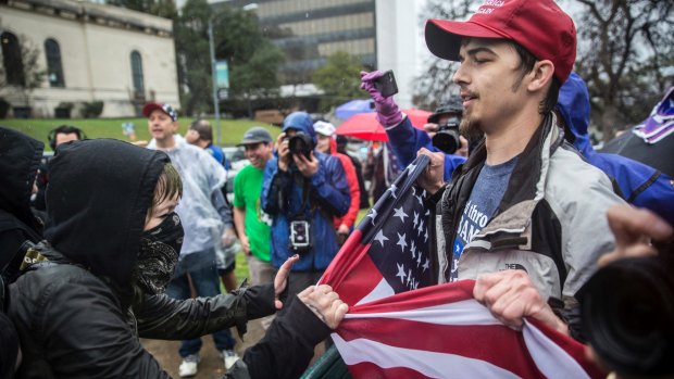 Counter-protesters clash with Trump supporters in Austin, Texas, during a "March 4 Trump" rally, one of several such events held in cities around the US on Saturday.