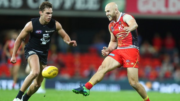 Gary Ablett gets a kick away but had a frustrating night for the Suns.