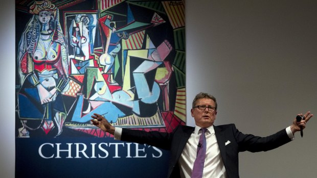 Auctioneer Jussi Pylkkanen calls for final bids before dropping the gavel on another Picasso panting <i>Women of Algiers</i> in May.