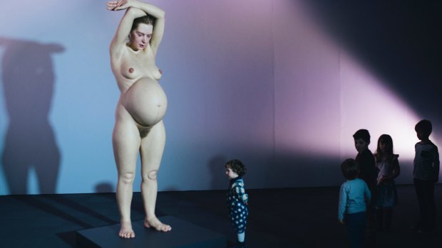 Yazid El-Aasar, 2, of Queanbeyan gets up close with Ron Mueck's Pregnant Woman.