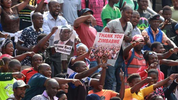 The crowd cheers and dances at the presidential inauguration ceremony of Emmerson Mnangagwa in Harare.