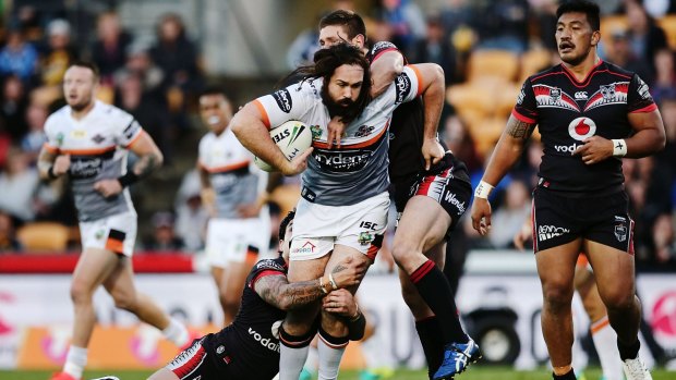 Inspirational: Aaron Woods is tackled by Issac Luke and Jacob Lillyman during the round 25 NRL match between the New Zealand Warriors and the Wests Tigers at Mount Smart Stadium.