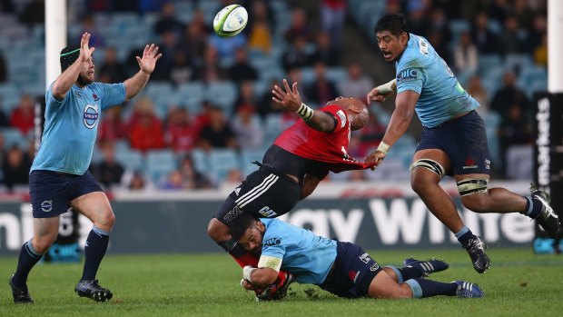 Outed: Will Skelton and Tolu Latu bring down Nemani Nadolo during Saturday's win over the Crusaders.