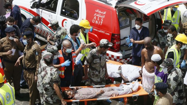 Emergency services attend to victims crushed in a crowd in Mina, Saudi Arabia during the annual hajj pilgrimage on Thursday.