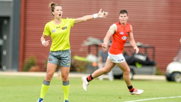 Taking charge: Field umpire Eleni Glouftsis  awards a free kick in the Essendon intra-club game.