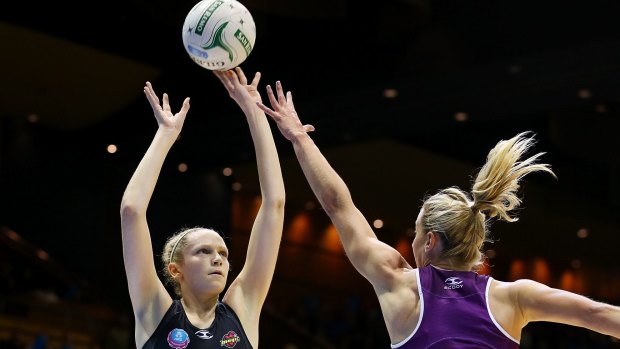 Revamp: Jo Harten of the Magic shoots for goal over Laura Geitz of the Firebirds in the ANZ Championship.