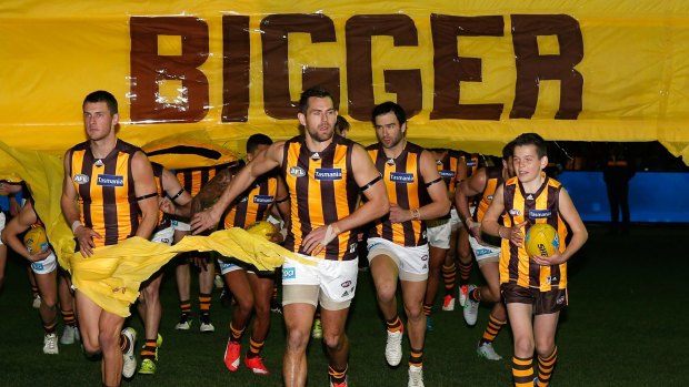 Leader: Luke Hodge (centre) has been key to Hawthorn's recent dominance.