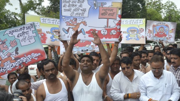 Activists from India's opposition Congress party shout slogans during a protest demanding resignation of Madhya Pradesh state Chief Minister Shivraj Singh Chouhan last week.