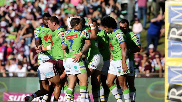 Forward, march: The Raiders celebrate a try from prop Paul Vaughan during the round 25 NRL match.