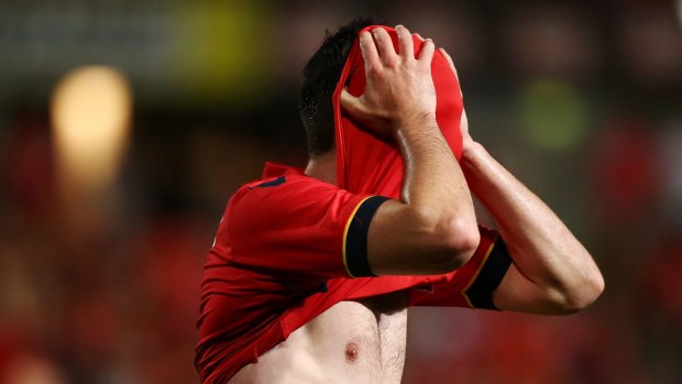 Season from hell: Dylan McGowan of Adelaide United reacts after the final whistle.