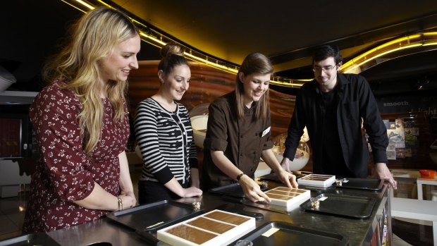 Visitors watch bar-making at York's Chocolate Story.